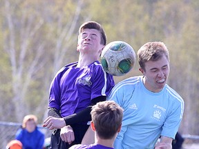 Lo Ellen Knights Jacob Socransky and St. Benedict Bears Alain Huneault battle for the ball during senior boys high school playoff soccer action in Sudbury, Ont. on Tuesday May 17, 2016. Gino Donato/Sudbury Star/Postmedia Network