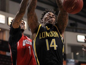 London Lightning?s Eric Kibi fights for a loose ball with Maurice Bolden of the Express during the first half of Game 3 of the National Basketball League of Canada Central Division final at the WFCU Centre in Windsor on Tuesday night. The Express won 107-99. (TYLER BROWNBRIDGE, Windsor Star)