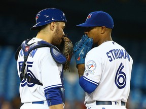 Blue Jays catcher Russell Martin talks to pitcher Marcus Stroman during action against the Tampa Bay Rays at the Rogers Centre in Toronto Tuesday May 17, 2016. (Dave Abel/Toronto Sun/Postmedia Network)