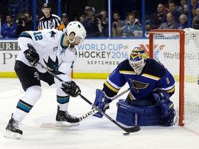 San Jose Sharks centre Patrick Marleau (12) tries to beat St. Louis Blues goalie Brian Elliott (1) during Game 2 of the Western Conference final Tuesday, May 17, 2016, in St. Louis. (AP Photo/Jeff Roberson)