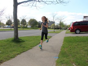 Ali Slager, 9, is running 100 km during the month of May to raise money for a friend and her family, who lost their home in the Fort McMurray wildfire. So far she's run 57 km and $700. Hers is one of many fundraisers in Southwestern Ontario for those in Alberta. (MEGAN STACEY/Sentinel-Review)