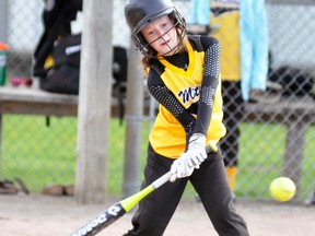 Ashtyn Wedow of the Mitchell Squirt #1 team reaches down to belt this double as the Hornets dumped Londesborough 10-6 last Monday, May 9. ANDY BADER MITCHELL ADVOCATE