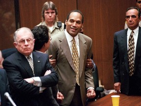 In this Oct. 3, 1995, file photo, O.J. Simpson, center, clenches his fists in victory after the jury said he was not guilty in the murders of his ex-wife Nicole Brown Simpson and her friend Ronald Goldman in a Los Angeles courtroom as attorneys F. Lee Bailey, left, and Robert Shapiro, right, look on. During an appearance on Fox's "Megyn Kelly Presents" on May 17, 2016, Shapiro said there's a “strong possibility” that the person who killed Simpson’s ex-wife, Nicole Brown-Simpson, and Ronald Goldman has never faced trial. (AP Photo/Los Angeles Daily News, Myung Chun, Pool, File)