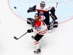 Canadian forward Taylor in action against Slovakian goalie Julius Hudacek at the world hockey championship in St. Petersburg, Russia on May 14, 2016. (REUTERS/Maxim Zmeyev)