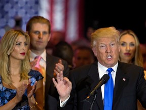 Republican U.S. presidential candidate Donald Trump is joined by his daughter Ivanka, left, and son Eric, background left, as he speaks during a primary night news conference, Tuesday, May 3, 2016, in New York. (AP Photo/Mary Altaffer)