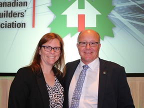 DRHBA President Heidi Stephenson congratulates Bob Finnigan, also of DHRBA, on becoming President of the Canadian Home Builders' Association in Kelowna, B.C. last week.
