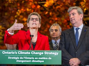 Ontario Premier Kathleen Wynne and Environment Minister Glen Murray talk to media about the new provincial climate change strategy at the Royal Ontario Museum on Nov. 24, 2015. (Ernest Doroszuk/Toronto Sun files)