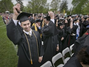 Dominic Joseph Doris of Marlton, N.J., moves his tassel across his mortarboard after graduating with a bachelor of arts in Health and Exercise Science during Rowan University graduation on Tuesday, May 10, 2016, Glassboro, N.J. (Alejandro A. Alvarez/The Philadelphia Inquirer via AP)