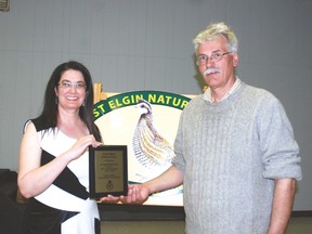 Dianne Dowling, left, president of the West Elgin Nature Club accepts a plaque from West Elgin Mayor Bernie Wiehle congratulating the club on its 70th anniversary.