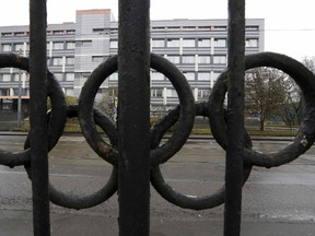 A view through a fence, decorated with the Olympic rings, shows a building which houses a laboratory accredited by the World Anti-Doping Agency in Moscow on Nov. 11, 2015. (REUTERS/Sergei Karpukhin/File Photo)