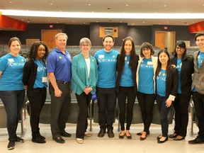 Canadian Cancer Society’s Research Information Outreach Team and Let’s Talk Science volunteers, seen here with Doug Kane of the Cancer Society of Kingston, third from left, and Lois Mulligan, one of the keynote speakers, put on Let’s Talk Cancer, a symposium about cancer for local high school students at Queen’s University. (Jane Willsie/The Whig-Standard)