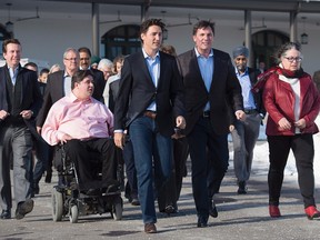 Prime Minister Justin Trudeau talks with Government House Leader Dominic LeBlanc as they head to a media availability during a cabinet retreat at the Algonquin Resort in St. Andrews, N.B. on  Jan. 18, 2016. THE CANADIAN PRESS/Andrew Vaughan