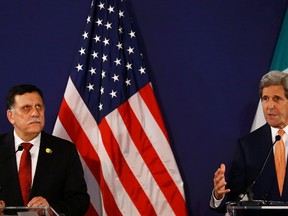 Libyan prime minister-designate Fayez al-Sarraj (L) and U.S. Secretary of State John Kerry attend a news conference in Vienna, Austria, May 16, 2016.  REUTERS/Leonhard Foeger/Pool