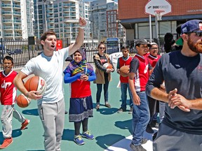 Coby Cotton and Tyler Toney of YouTube stars Dude Perfect do some drills with kids at the Harbourfront  Community Centre in Toronto on Wednesday May 18, 2016. Michael Peake/Toronto Sun/Postmedia Network