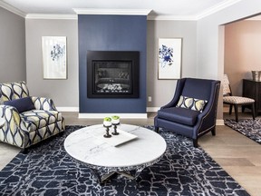 This finished living room space was part of a whole home transformation. New custom-made Canadian furniture, area rugs and a Hale Navy accent wall complete the look. (Designer: Cassandra Nordell/Copyright William Standen Co. 2016 )