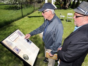 Griffin Ketcheson and his son, Robert, read a plaque mentioning their grandfather and great-grandfather, Col. William Ketcheson, at Old Sidney Town Hall Park in Wallbridge. It was one of four City of Quinte West plaques dedicated to local residents and history unveiled during the morning.