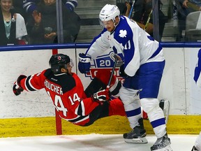 Zach Hyman of the Marlies runs into the Devils’ Reid Boucher on Monday. The Marlies and Bears start their series on Friday. (Dave Abel/Toronto Sun)