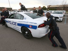 Peel Regional Police platoon has fun with Const. Brian Mortotsi at 12 Division on May 18, 2016. Mortotsi came to the aid of a woman who stalled her car in an intersection and Mortotsi pushed it to safety. (Dave Abel/Toronto Sun)
