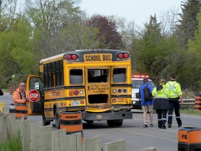 Seven children were taken to hospital, at least two seriously, after a collision between a school bus and a tanker truck on Steeles Ave. and 6th Line in Milton. (Andrew Collins/Special to the Toronto Sun)