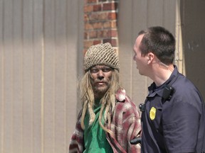 Jordan Kajewski, 29, of Carroll, Iowa, walks from Carroll Redemption Center, where he was arrested for trying to break in the night of May 17, 2016. Kajewski got stuck in a chimney there for at least eight hours. Kajewksi crawled into the chimney during the night of May 17, 2016, and was rescued the following day. He was naked and covered in soot, though he had his clothes with him. He was charged with trespassing. (Jared Strong/Carroll Daily Times Herald via AP)