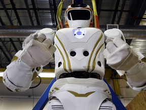 In this May 2, 2016 photo, a six-foot-tall, 300-pound Valkyrie robot is seen at University of Massachusetts-Lowell's robotics centre in Lowell, Mass. "Val," one of four sister robots built by NASA, could be the vanguard for the colonization of Mars by helping to set up a habitat for future human explorers. (AP Photo/Elise Amendola)