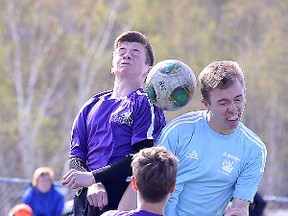 Lo Ellen Knights Jacob Socransky and St. Benedict Bears Alain Huneault battle for the ball during senior boys high school playoff soccer action in Sudbury, Ont. on Tuesday May 17, 2016. Gino Donato/Sudbury Star/Postmedia Network