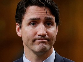 Prime Minister Justin Trudeau pauses while responding to questions after delivering an apology in the House of Commons on Parliament Hill in Ottawa, May 19, 2016 following a physical alteration the previous day. REUTERS/Chris Wattie