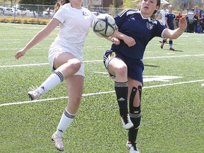 Marymount Academy Regals Mackenzie Watkins and Notre Dame Alouettes Chanelle Lafortune battle for the ball during senior girls high school playoff action in Sudbury, Ont. on Tuesday May 17, 2016. Gino Donato/Sudbury Star/Postmedia Network