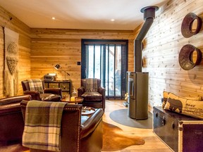 A whisky bar area complete with a quartet of leather Bowring chairs is the perfect nook from which to gaze dreamily at a log fire's burning flames.