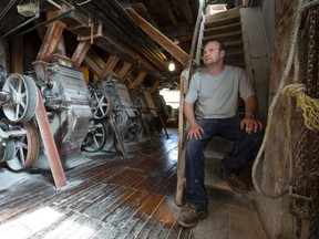 Mike Matthews, fourth generation owner of the Arva Flour Mill, sits inside the roughly 200 year old mill in London, Ont. on Thursday May 19, 2016. Matthews is the only person allowed in the mill while it is running after a recent notice from the Ministry of Labour citing improper employee protections, which didn't exist when the mill was built.  Matthews says there haven't been injuries to employees as long as records have been kept at the flour mill north of London. (CRAIG GLOVER, The London Free Press)