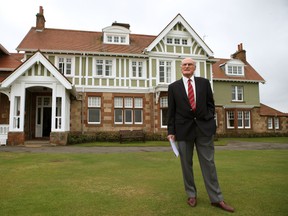 Henry Fairweather stands in front of Muirfield golf club clubhouse, as he prepares to make an announcement on the outcome of a membership ballot in Muirfield, Scotland, Thursday May 19, 2016. (Andrew Milligan/PA via AP)