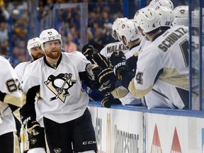 Pittsburgh Penguins winger Phil Kessel (left) is congratulated by teammates after he scored against the Tampa Bay Lightning during Game 3 of the Eastern Conference final Wednesday at Amalie Arena. (Kim Klement/USA TODAY Sports)