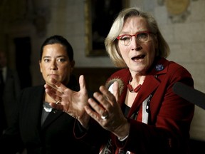 Canada's Indigenous Affairs Minister Carolyn Bennett (R) speaks during a news conference on Parliament Hill in Ottawa on January 26, 2016. REUTERS/Chris Wattie
