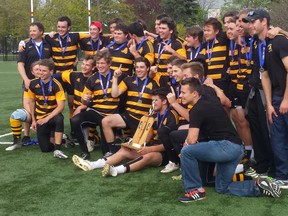 The La Salle Black Knights celebrate after beating the Regiopolis-Notre Dame Panthers 15-7 in the Kingston Area senior boys rugby final at Nixon Field on Thursday. (Doug Graham/The Whig-Standard)