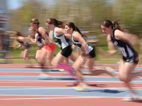 Athletes compete in a senior girls 100 metre heat at the local high school track and field championships at the track at Laurentian University in Sudbury, Ont. on Thursday May 19, 2016. John Lappa/Sudbury Star/Postmedia Network