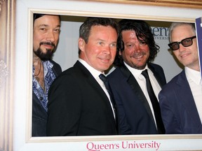 Rob Baker, left to right, Gord Sinclair, Paul Langlois, and Johnny Fay of the The Tragically Hip received honorary doctorates of law from Queen's University alongside graduates of the school of medicine in Kingston. (Steph Crosier/The Whig-Standard)
