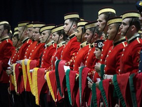 Officer cadets stand at attention during he 105th Royal Military College convocation at the Kingston Military Community Sports Centre on Thursday. (Ian MacAlpine/The Whig-Standard)
