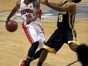 London Lightning Akeem Scott, right, draws a foul against Brandon Robinson of the Express during Game 4 of the NBL of Canada Central Division final at the WFCU Centre in Windsor on Thursday night. London won 111-108. (NICK BRANCACCIO/Windsor Star)