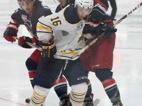 Carleton Place Canadians Nicolas Carrier feuds with members of the Brooks Bandits during the RBC Cup at the Centennial Civic Centre on Thursday, May 19, 2016 in Lloydminster, Sask.