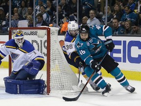 San Jose Sharks defenceman Roman Polak (46) skates past St. Louis Blues forward Troy Brouwer (36) to take a shot on goalie Brian Elliott during Game 3 of the Western Conference final Thursday, May 19, 2016, in San Jose, Calif. (AP Photo/Marcio Jose Sanchez)