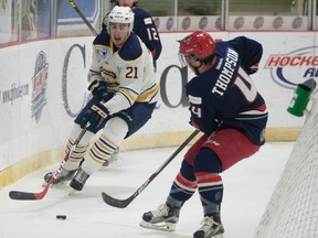 Carleton Place Canadians’ Brett Murray tries to skate past Tristan Thompson of the Brooks Bandits at the RBC Cup. (Eric Healey, Postmedia Network)