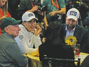 J. Paul Reddam (far left), jockey Mario Gutierrez (middle) and trainer Doug O’Neill hold court with reporters about Nyquist’s Preakness Stakes bid at Pimlico. (AP)