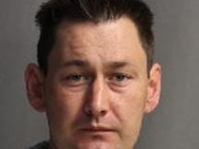 Colin Copestock, 35, faces charges for allegedly robbing seniors at a Scarborough apartment complex while pretending to be a cop. PHOTO SUPPLIED BY TORONTO POLICE
