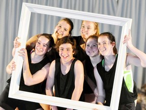 Stacey Louwagie (clockwise from bottom left), Charlene Louwagie, Lydia Power, Sarah Murray, Laura Fischer and Gage Rohfritsch, all longtime senior gym team members, are framed during their routine. ANDY BADER MITCHELL ADVOCATE