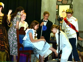 Deviating from the original story a bit, the “glass slipper” does not fit Cinderella's foot as it was the Fairy Godmother who lost her footwear during the royal ball. Pictured from left, Ella Mann playing the Baroness, Jenna Deck as Flora, Danielle Vogels as Fauna, Kimmi Doyle as Cinderella, Arianna Catalan as Button the butler, Erica Pletsch as Dandini the luxury cruise operator, and Sam Snyders as Prince Charming. GALEN SIMMONS MITCHELL ADVOCATE