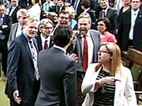 Local Input~ May 18, 2016 --Ottawa, ON - Prime Minister Justin Trudeau goes across the floor to engage Thomas Mulcair in the House of Commons, shown in this video frame grab.