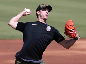 Pitcher Tim Lincecum throws for MLB baseball scouts at Scottsdale Stadium in Scottsdale, Ariz. on May 6, 2016. (AP Photo/Matt York)