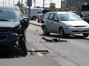 Emergency services respond to a two vehicle collision at the intersection of Princess Street and Centennial Drive in Kingston, Ont. on Friday May 20, 2016. Steph Crosier/Kingston Whig-Standard/Postmedia Network