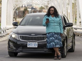 Ingrid Goddard, 41, has been driving for Uber since last August. She is one of the roughly 500 women who drive for the ride-ordering company in Ottawa, a city that rarely sees women drive taxis.  Darren Brown