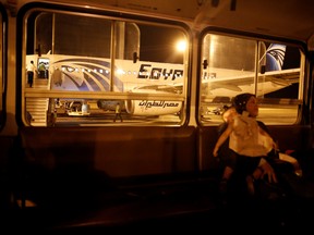 A passenger and her daughter sit in a bus after their EgyptAir flight arrived from Cairo to Luxor International Airport, Egypt May 19, 2016. REUTERS/Amr Abdallah Dals